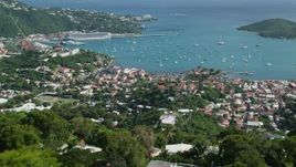 4.8K aerial stock footage reveal coastal town and Caribbean blue waters, Northside, Charlotte Amalie Aerial Stock Footage | AX102_294E