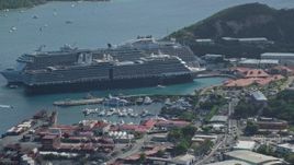 4.8K aerial stock footage of a Docked cruise ships in turquoise blue Caribbean waters, Charlotte Amalie, St Thomas  Aerial Stock Footage | AX102_304