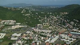 4.8K aerial stock footage of Hillside homes among trees near the coast, Charlotte Amalie, St Thomas Aerial Stock Footage | AX103_006