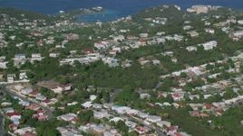 4.8K aerial stock footage of Coastal homes among trees along Caribbean blue waters, East End, St Thomas Aerial Stock Footage | AX103_011