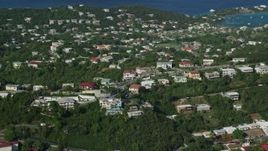 4.8K aerial stock footage of upscale homes on wooded hilltop, East End, St Thomas Aerial Stock Footage | AX103_011E