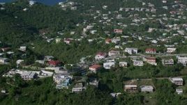 4.8K aerial stock footage of Homes among tree covered hills, East End, St Thomas Aerial Stock Footage | AX103_012