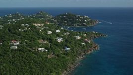 4.8K aerial stock footage of Hillside homes overlooking sapphire blue ocean waters, Cruz Bay, St John Aerial Stock Footage | AX103_020