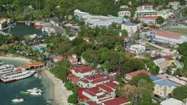 4.8K aerial stock footage of Waterfront Caribbean shops, Cruz Bay, St John Aerial Stock Footage | AX103_031