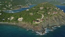 4.8K aerial stock footage of oceanfront homes and hillside mansions along sapphire blue waters, Cruz Bay, St John Aerial Stock Footage | AX103_035E