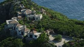 4.8K aerial stock footage of hilltop mansion with a sapphire blue ocean view, Cruz Bay, St John Aerial Stock Footage | AX103_038E