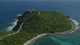 4.8K aerial stock footage of a Cliff top mansion among trees and sapphire blue Caribbean waters, Cruz Bay, St John Aerial Stock Footage | AX103_043