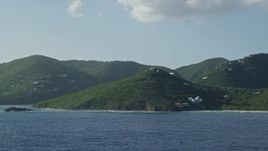 4.8K aerial stock footage of Hillside mansions along Caribbean blue waters, Cruz Bay, St John Aerial Stock Footage | AX103_058