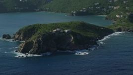 4.8K aerial stock footage of cliff top mansion along Caribbean blue waters, Cruz Bay, St John Aerial Stock Footage | AX103_059