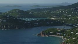 4.8K aerial stock footage of a hilltop and cliff top mansions near Caribbean blue waters, Cruz Bay, St John Aerial Stock Footage | AX103_060E