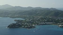 4.8K aerial stock footage of Homes nestled in trees around Caribbean blue waters of the bay, East End, St Thomas Aerial Stock Footage | AX103_063
