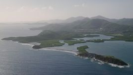 4.8K aerial stock footage of Tiny islands in sapphire blue Caribbean waters off the coast, East End, St Thomas Aerial Stock Footage | AX103_064