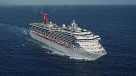 4.8K aerial stock footage of a Carnival cruise ship in sapphire blue Caribbean waters, St Thomas Aerial Stock Footage | AX103_070E