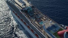 4.8K aerial stock footage of the pool area of carnival cruise ship in Caribbean blue waters,  St Thomas Aerial Stock Footage | AX103_076E