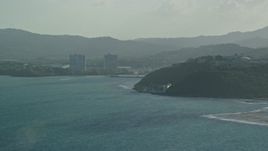 4.8K aerial stock footage of a Coastal town along Caribbean blue waters, Fajardo, Puerto Rico Aerial Stock Footage | AX103_116