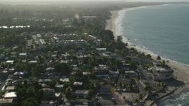4.8K aerial stock footage of beachfront homes and Caribbean beach along blue waters, Loiza, Puerto Rico Aerial Stock Footage | AX103_133E