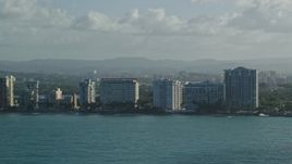 4.8K aerial stock footage of condominiums along Caribbean blue waters, Carolina, Puerto Rico Aerial Stock Footage | AX103_147E