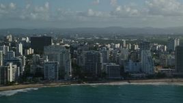4.8K aerial stock footage of condo complexes along Caribbean blue waters, San Juan, Puerto Rico Aerial Stock Footage | AX103_149E