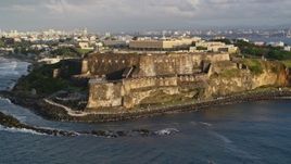 4.8K aerial stock footage of Fort San Felipe del Morro, Old San Juan, sunset Aerial Stock Footage | AX104_004E
