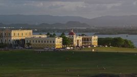 4.8K aerial stock footage of Escuela De Artes Plasticas De Puerto Rico, sunset Aerial Stock Footage | AX104_028