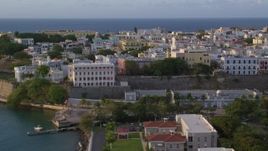 4.8K aerial stock footage of La Fortaleza and neighboring buildings, Old San Juan sunset Aerial Stock Footage | AX104_037