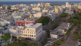 4.8K aerial stock footage of La Fortaleza and neighboring buildings, Old San Juan sunset Aerial Stock Footage | AX104_039