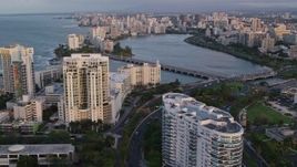 4.8K aerial stock footage of Avenida Ashford bridge and high-rises, San Juan, Puerto Rico, sunset Aerial Stock Footage | AX104_058