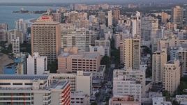 4.8K aerial stock footage of Oceanside Caribbean hotels and apartment buildings, San Juan, Puerto Rico sunset Aerial Stock Footage | AX104_062
