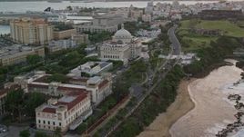 4.8K aerial stock footage of San Juan Capitol Building along the coast, Puerto Rico, sunset Aerial Stock Footage | AX104_077