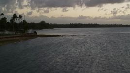 4.8K aerial stock footage of the Caribbean coastline along ocean waters, Dorado, Puerto Rico, twilight Aerial Stock Footage | AX104_110
