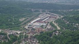 4.8K aerial stock footage approaching a large factory, Turtle Creek, Pennsylvania Aerial Stock Footage | AX105_005