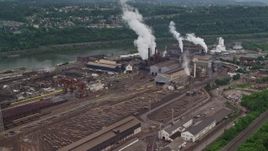 4.8K aerial stock footage approaching U.S. Steel Mon Valley Works Factory, Braddock, Pennsylvania Aerial Stock Footage | AX105_009E