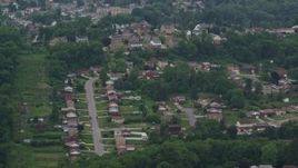 4.8K aerial stock footage orbiting hilltop suburban homes, West Mifflin, Pennsylvania Aerial Stock Footage | AX105_019