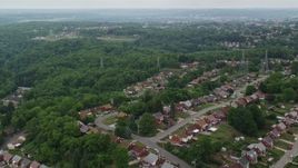 4.8K aerial stock footage flying over suburban homes and trees, West Mifflin, Pennsylvania Aerial Stock Footage | AX105_022