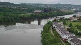 4.8K aerial stock footage of Railroad Bridge near Factory, Carrie Furnace, Pittsburgh, Pennsylvania Aerial Stock Footage | AX105_029E