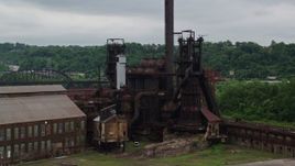 4.8K aerial stock footage orbiting a steel factory, Carrie Furnace, Pittsburgh, Pennsylvania Aerial Stock Footage | AX105_040E