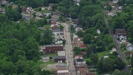 4.8K aerial stock footage of homes and shops on a small town road, Penn Hills, Pennsylvania Aerial Stock Footage | AX105_092E