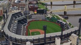 4.8K aerial stock footage orbiting PNC Park tilt to reveal Downtown Pittsburgh, Pennsylvania Aerial Stock Footage | AX105_123E