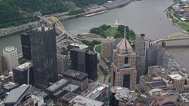 4.8K aerial stock footage flying over U.S. Steel Tower toward Point State Park in Downtown Pittsburgh, Pennsylvania Aerial Stock Footage | AX105_183E