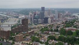 4.8K aerial stock footage of Downtown seen from a hill across the river, Downtown Pittsburgh, Pennsylvania Aerial Stock Footage | AX105_229E