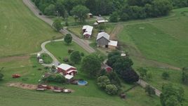 4.8K aerial stock footage of a ranch house and a red barn, Pittsburgh, Pennsylvania Aerial Stock Footage | AX105_257E