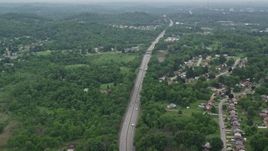 4.8K aerial stock footage flying over suburbs revealing freeway, Pittsburgh, Pennsylvania Aerial Stock Footage | AX105_259E