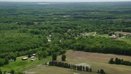 4.8K aerial stock footage of farmland and forest in Newton Falls, Ohio Aerial Stock Footage | AX106_135E