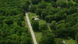 4.8K aerial stock footage of a country road and rural homes in Windham, Ohio Aerial Stock Footage | AX106_139E