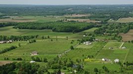 4.8K aerial stock footage of farmland and country road in Windham, Ohio Aerial Stock Footage | AX106_142E