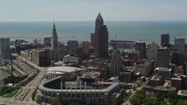 4.8K aerial stock footage fly over Progressive Field and between skyscrapers in Downtown Cleveland, Ohio Aerial Stock Footage | AX106_257E