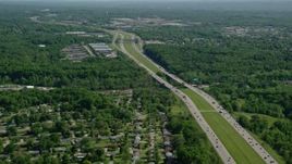 4.8K aerial stock footage of an interstate among trees with light traffic, Cleveland, Ohio Aerial Stock Footage | AX107_062