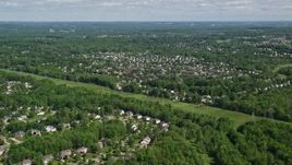 4.8K aerial stock footage of a suburban neighborhood among trees, Solon, Ohio Aerial Stock Footage | AX107_064