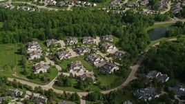 4.8K aerial stock footage flying over trees and lakeside homes, Aurora, Ohio Aerial Stock Footage | AX107_072E