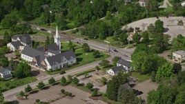 4.8K aerial stock footage flying by a church along a busy road, Aurora, Ohio Aerial Stock Footage | AX107_075